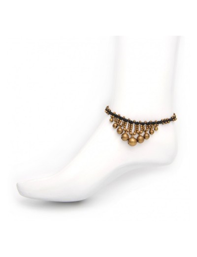 Anklet plaited in macramé with brass bells.